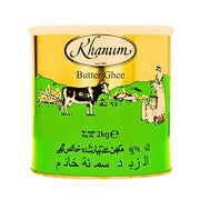 Guldgrön burk med ghee, illustrerad ko och kvinna, text Butter Ghee, 2kg.